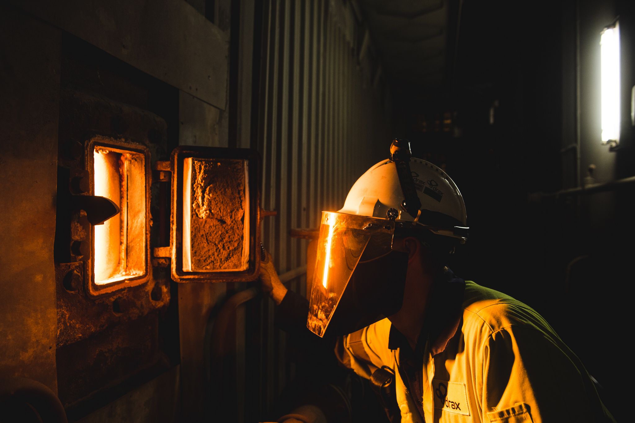 Engineer looking into Biomass furnace [Image courtesy Drax Power]