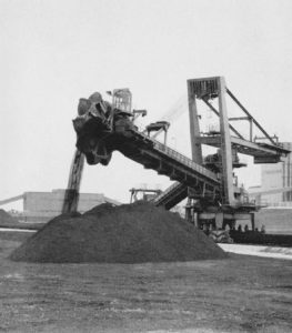 Giant boom stacker in operation, 1970